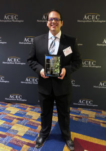 Electrical engineer Mike Fisk accepting design award for M.C. Dean.